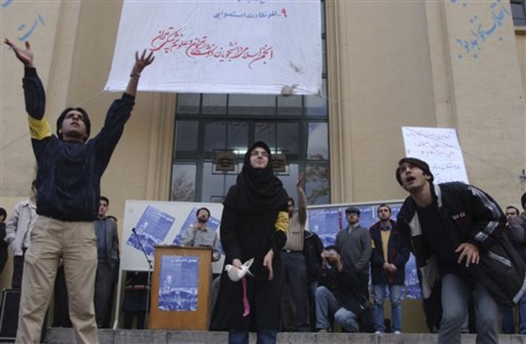 A female Iranian university student, center, and two male students release pigeons during a gathering to mark the national annual Student Day, at Tehran University campus in Iran, on Dec. 7, 2003. Iranian President Mahmoud Ahmadinejad, reviled by the opposition as a figurehead of hard-line rule, is now temporarily in the reformists corner by opposing plans to segregate male and female students at Iranian universities. 